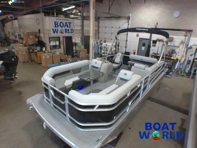 Slide: The Image of 2025 Princecraft Vectra 23 RL pontoon boat in showroom, featuring spacious seating and modern design. - 40