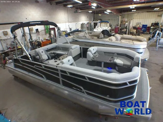 Slide: The Image of 2025 Princecraft Vectra 23 RL pontoon boat in showroom, featuring spacious seating and modern design. - 41