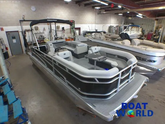 Slide: The Image of 2025 Princecraft Vectra 23 RL pontoon boat in showroom, featuring lounge seating. - 43