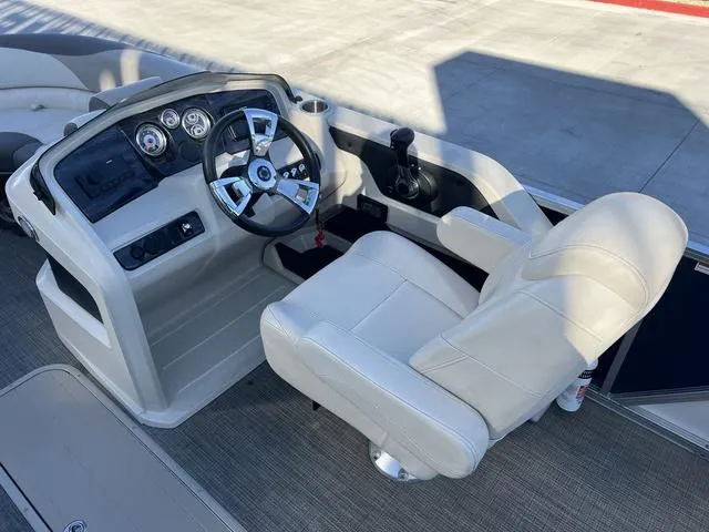 Slide: The Image of 2021 Avalon LSZ Versatile Rear Bench 24 FT boat helm with steering wheel and controls. - 13