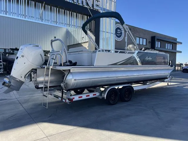 Slide: The Image of 2021 Avalon LSZ Versatile Rear Bench 24 FT pontoon boat on trailer. - 3