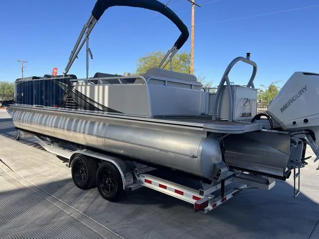 Slide: The Image of 2021 Avalon LSZ Versatile Rear Bench 24 FT pontoon boat on trailer. - 5