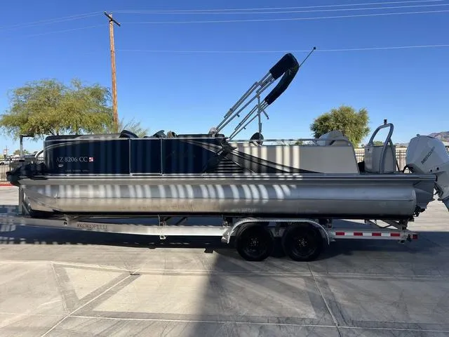 Slide: The Image of 2021 Avalon LSZ Versatile Rear Bench 24 FT pontoon boat on trailer. - 6