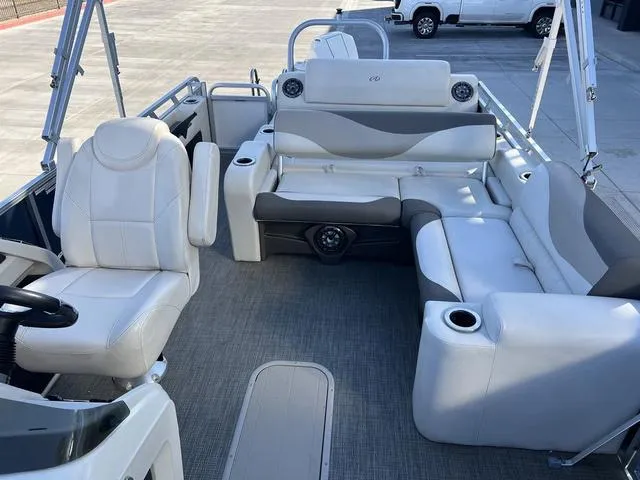 Slide: The Image of 2021 Avalon LSZ Versatile Rear Bench 24 FT pontoon boat interior with plush seating. - 9
