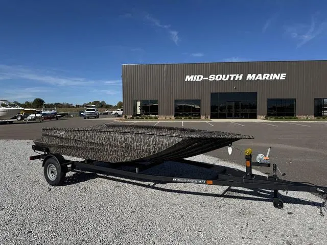 Slide: The Image of 2025 Edge Duck Boats 656 DB MB OG CAMO on trailer, outdoor display. - 4