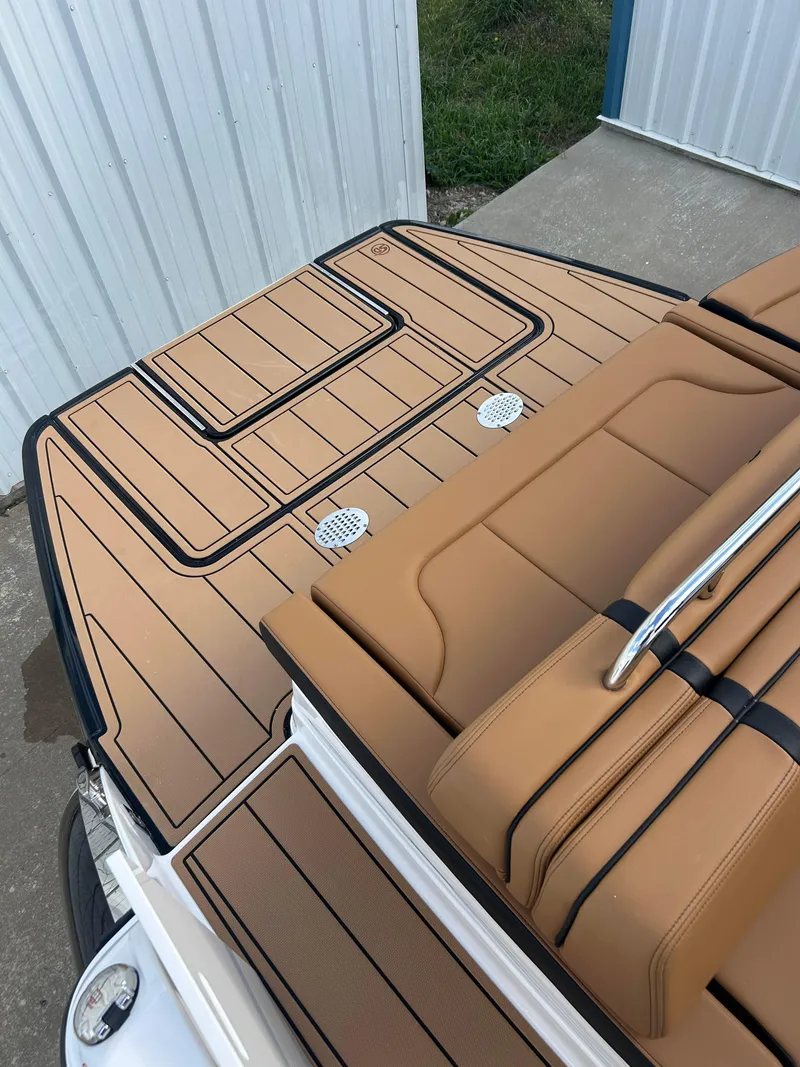 Slide: The Image of 2025 Chaparral 30 Surf boat deck with tan seating and sleek design. - 3