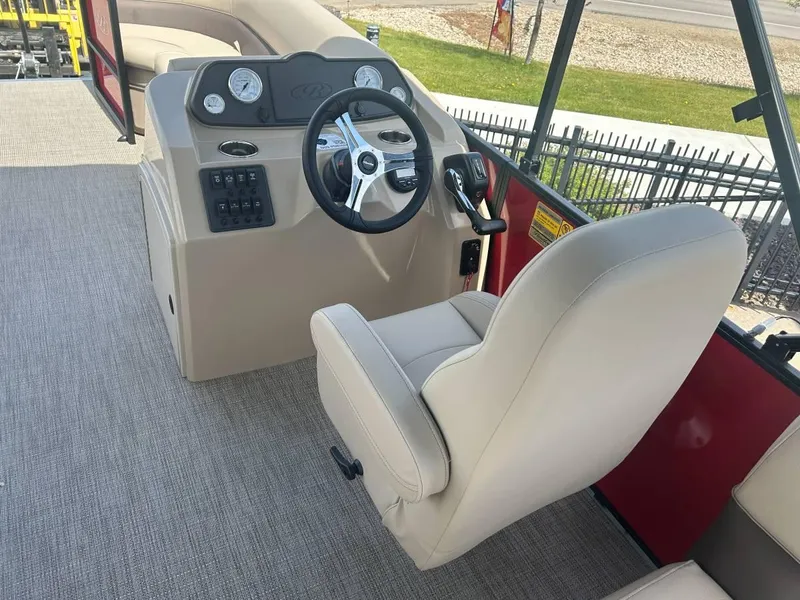 Slide: The Image of 2024 Bentley Pontoons LE 200 Cruise helm with beige captain's chair and steering wheel. - 3