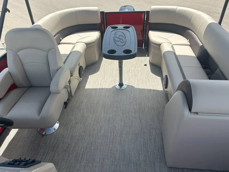 Slide: The Image of 2024 Bentley Pontoons LE 200 Cruise interior with plush seating and central table. - 6