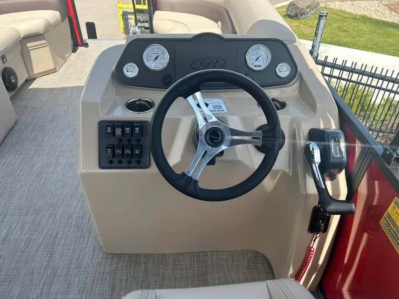 Slide: The Image of 2024 Bentley Pontoons LE 200 Cruise dashboard with steering wheel and controls. - 7