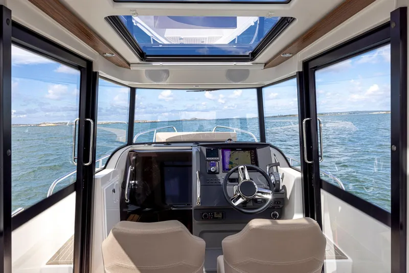 Slide: The Image of Interior view of 2025 Nimbus C8 boat cockpit with ocean view. - 6