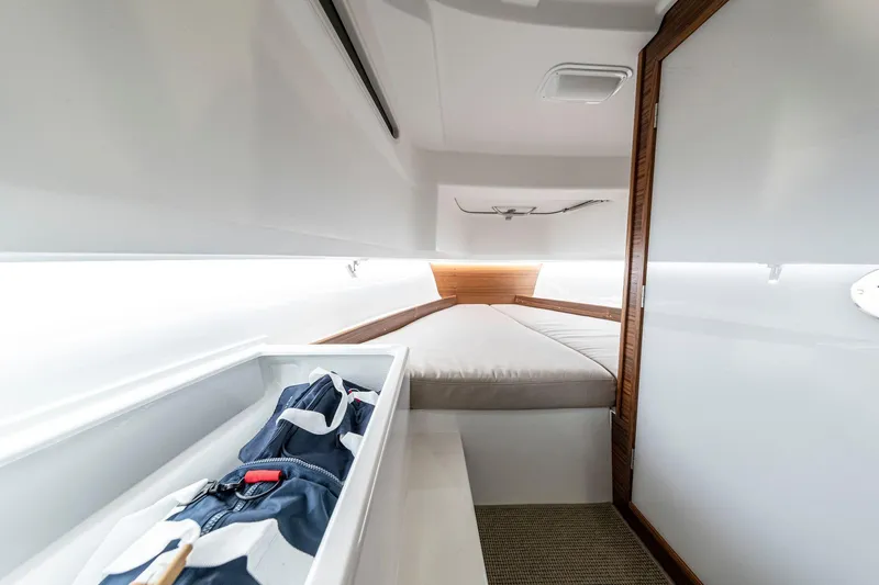 Slide: The Image of Interior cabin of 2025 Nimbus C8 boat with bed and storage. - 9