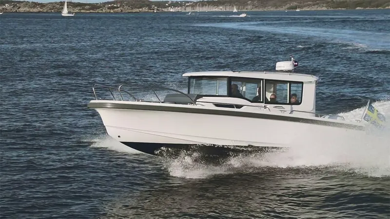 Slide: The Image of Nimbus C9 2025 motorboat cruising on open water. - 11