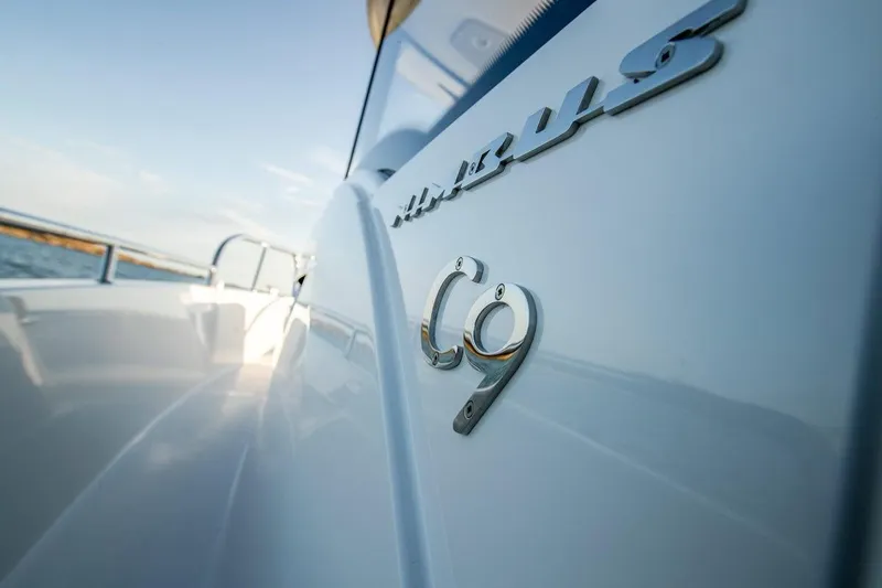 Slide: The Image of 2025 Nimbus C9 boat, sleek design, close-up of model emblem. - 20