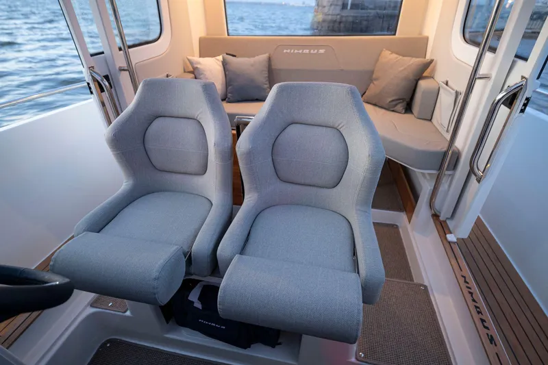Slide: The Image of Luxurious interior of 2025 Nimbus C9 boat with plush seating and scenic water view. - 5