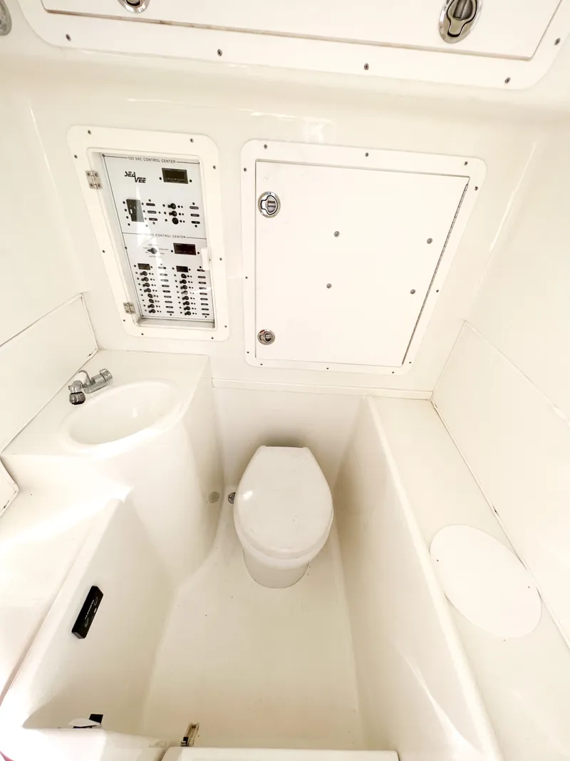 Slide: The Image of 2017 SeaVee 390z Center Console boat interior with toilet and control panel. - 22