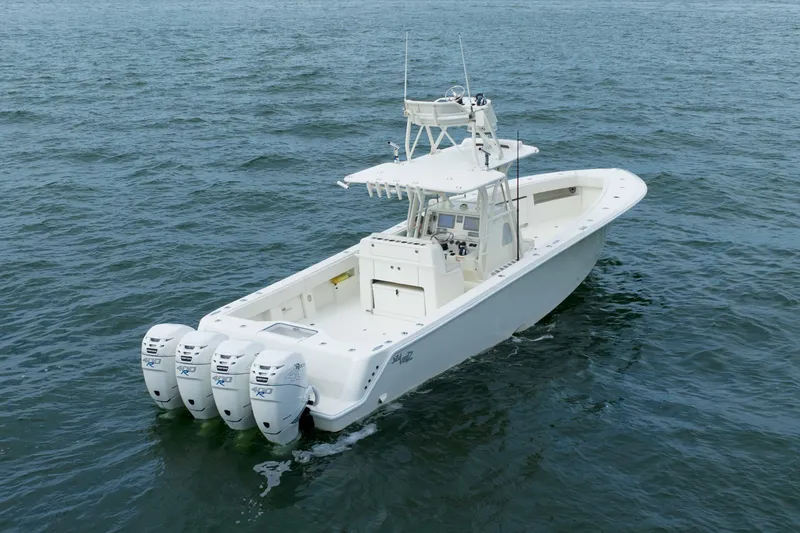 Slide: The Image of 2017 SeaVee 390z Center Console boat with four outboard engines on open water. - 3