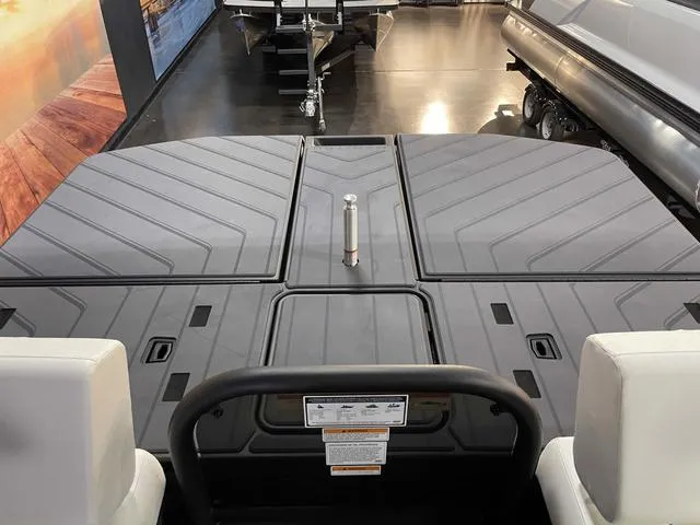 Slide: The Image of 2024 Manitou EXPLORE 24 MAX SGP boat deck with dual engine setup. - 18