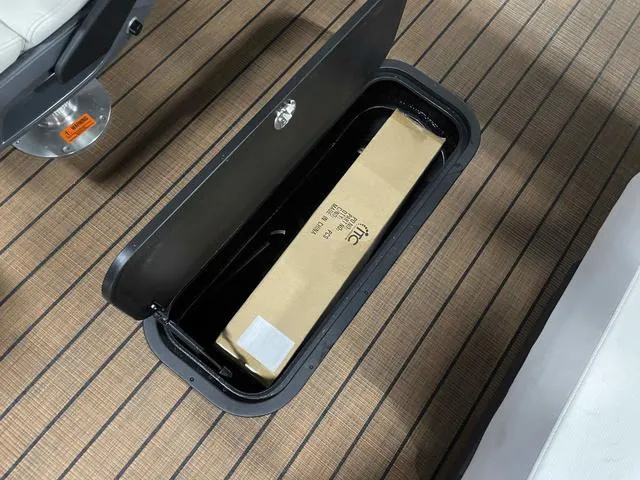 Slide: The Image of Storage compartment in 2024 Manitou EXPLORE 24 MAX SGP DUAL ENGINE boat. - 19