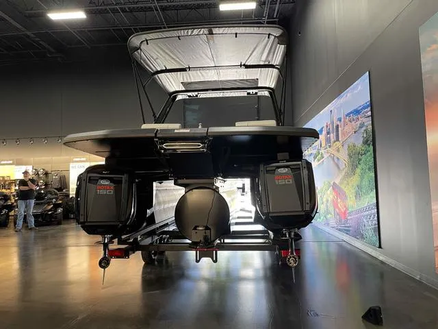 Slide: The Image of 2024 Manitou EXPLORE 24 MAX SGP dual engine boat in showroom. - 5