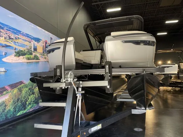 Slide: The Image of 2024 Manitou EXPLORE 24 MAX SGP dual engine pontoon boat in showroom. - 8