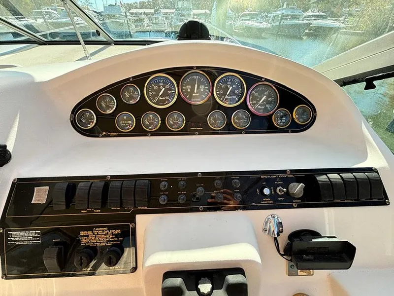 Slide: The Image of Dashboard of 2000 Cruisers Yachts 3375 Express with gauges and controls. - 15