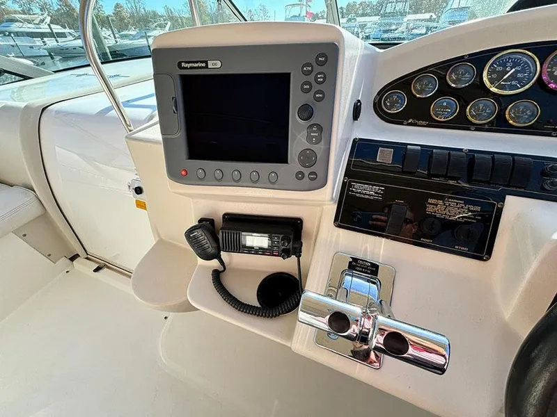 Slide: The Image of Control panel of 2000 Cruisers Yachts 3375 Express with navigation and communication equipment. - 16