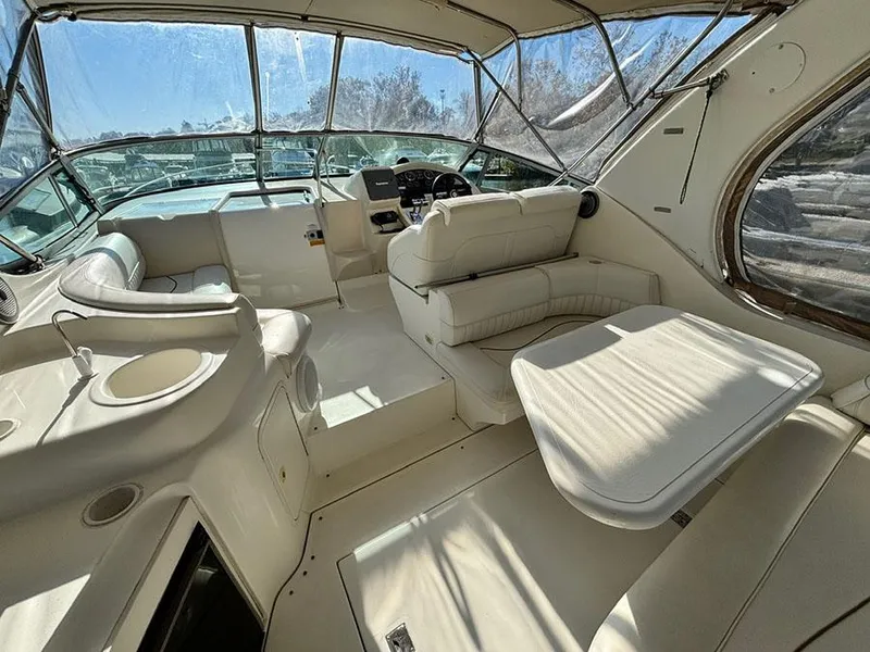 Slide: The Image of Interior of 2000 Cruisers Yachts 3375 Express, featuring spacious seating and helm area. - 7