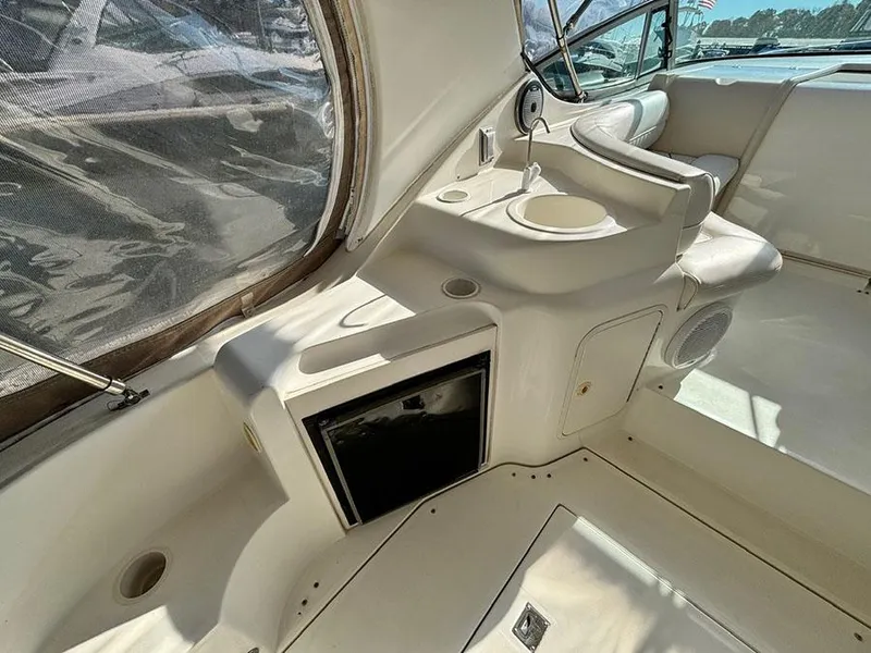 Slide: The Image of 2000 Cruisers Yachts 3375 Express interior with seating and control panel. - 9