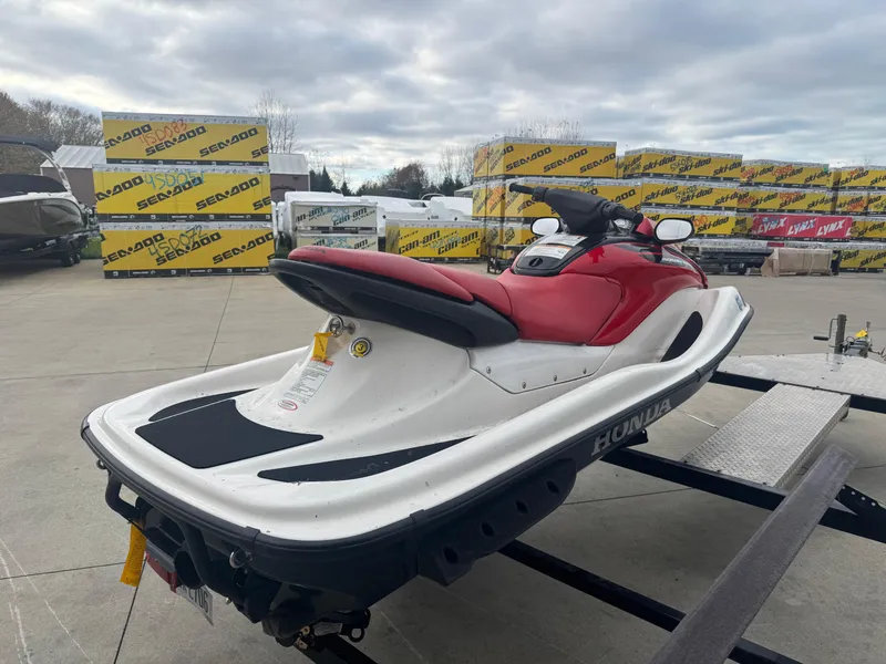Slide: The Image of 2006 Honda Aquatrax F-12X jet ski with red seat on a trailer. - 3