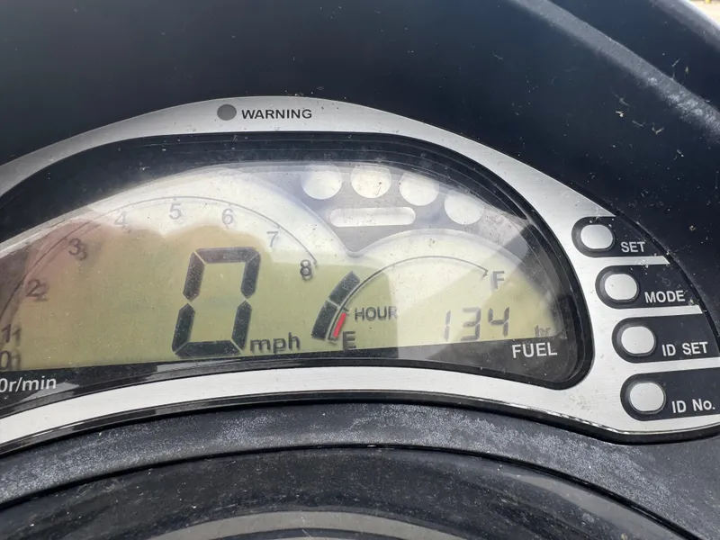 Slide: The Image of 2006 Honda Aquatrax F-12X dashboard displaying 0 mph and fuel level. - 5