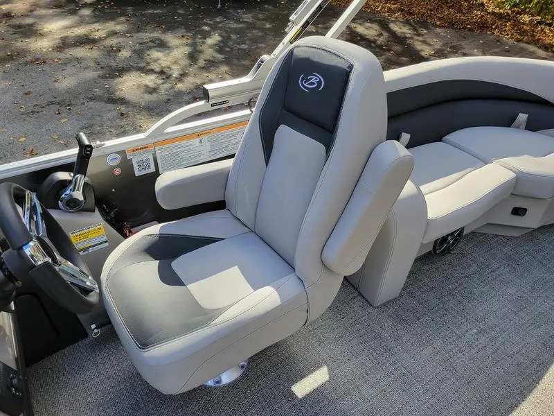 Slide: The Image of 2025 Barletta A20QC boat interior with plush seating and modern controls. - 18