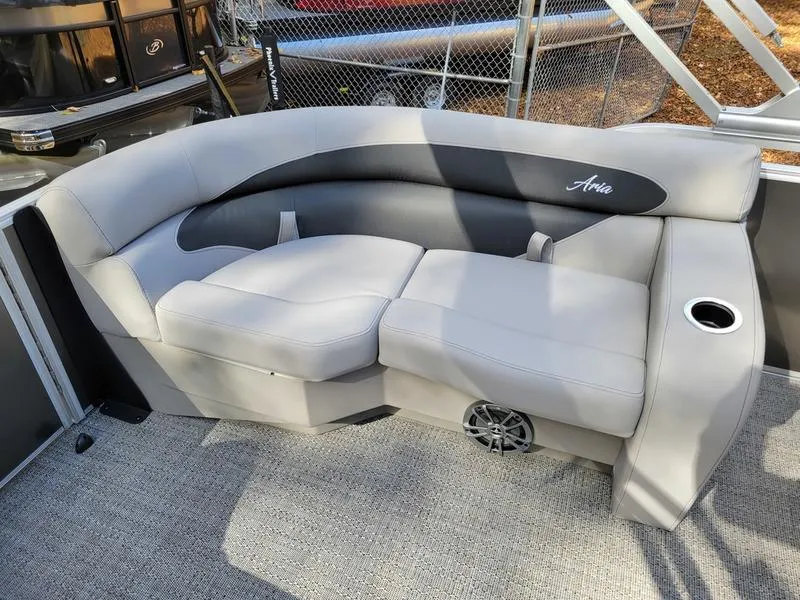 Slide: The Image of 2025 Barletta A20QC boat interior with gray cushioned seating and cup holder. - 20