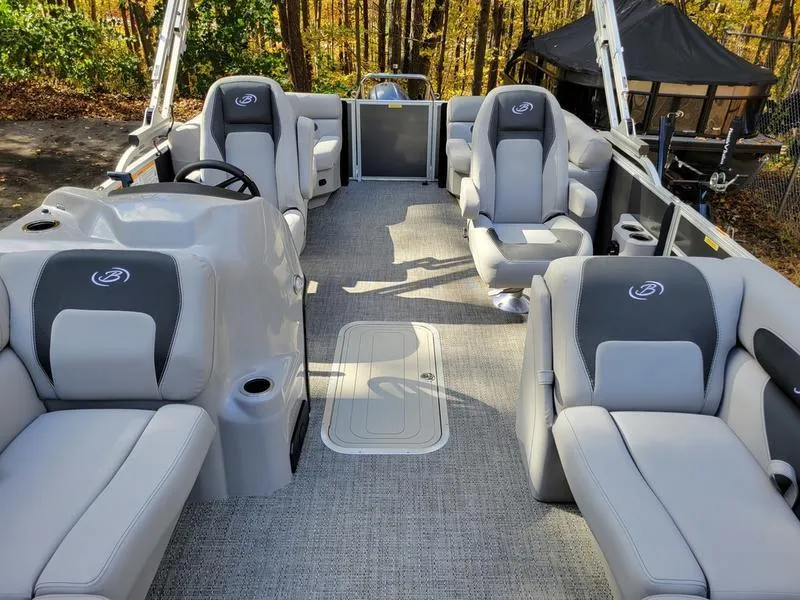 Slide: The Image of 2025 Barletta A20QC pontoon boat interior with plush seating and modern design. - 22