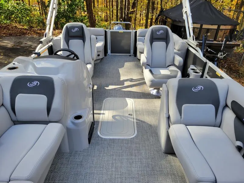 Slide: The Image of 2025 Barletta A20QC pontoon boat interior with plush seating and modern design. - 23