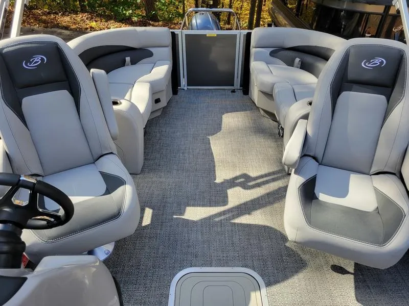 Slide: The Image of 2025 Barletta A20QC boat interior with gray seating and carpet flooring. - 24