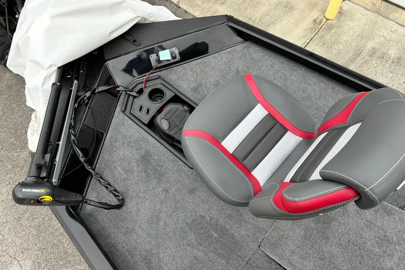 Slide: The Image of 2024 Ranger RT188 boat interior with gray and red seat, trolling motor, and control panel. - 10