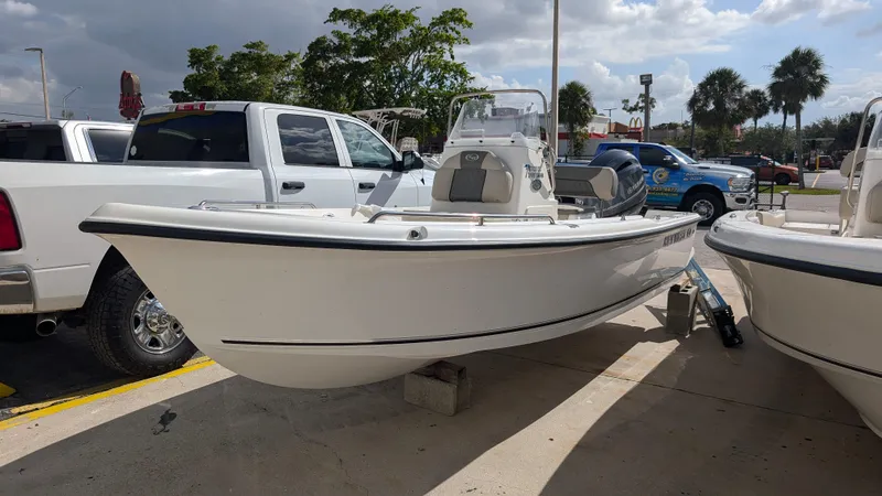 The Image of 2026 Key West 1720 Center Console boat on trailer, parked outdoors. - 0
