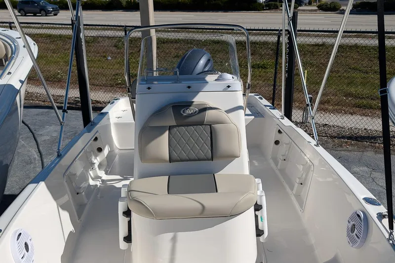 Slide: The Image of 2026 Key West 1720 Center Console boat with beige seating and modern design. - 10