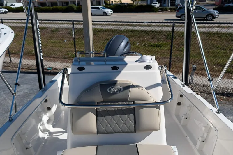Slide: The Image of 2026 Key West 1720 Center Console boat interior with steering console and seating. - 11