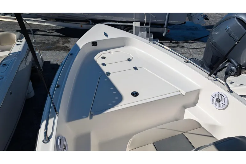 Slide: The Image of 2026 Key West 1720 Center Console boat interior with storage compartments and Yamaha engine. - 13