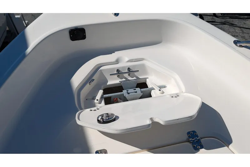 Slide: The Image of 2026 Key West 1720 Center Console boat anchor storage compartment, open and empty. - 14
