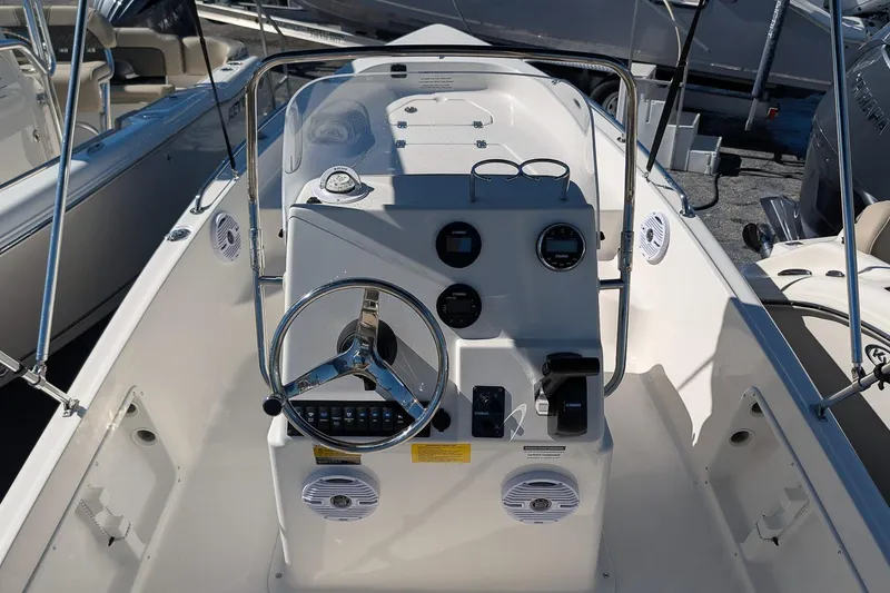 Slide: The Image of 2026 Key West 1720 Center Console boat interior with steering wheel and controls. - 9