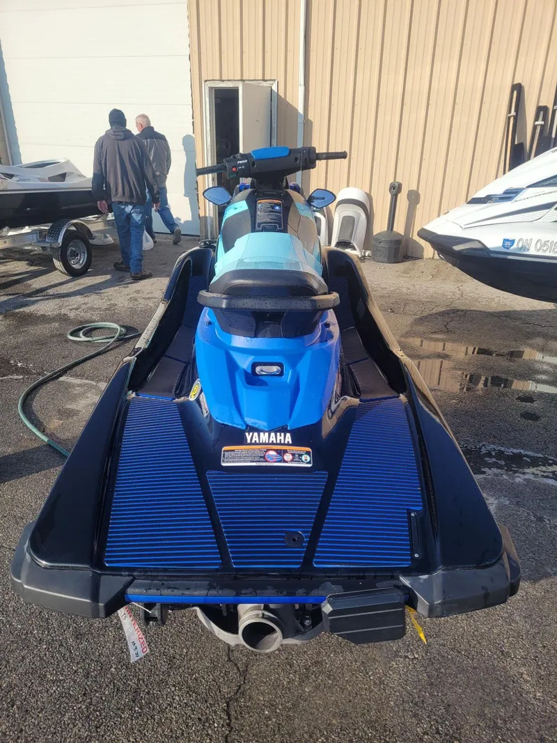 Slide: The Image of 2022 Yamaha WaveRunner EX Deluxe, blue, parked outdoors near a building. - 3