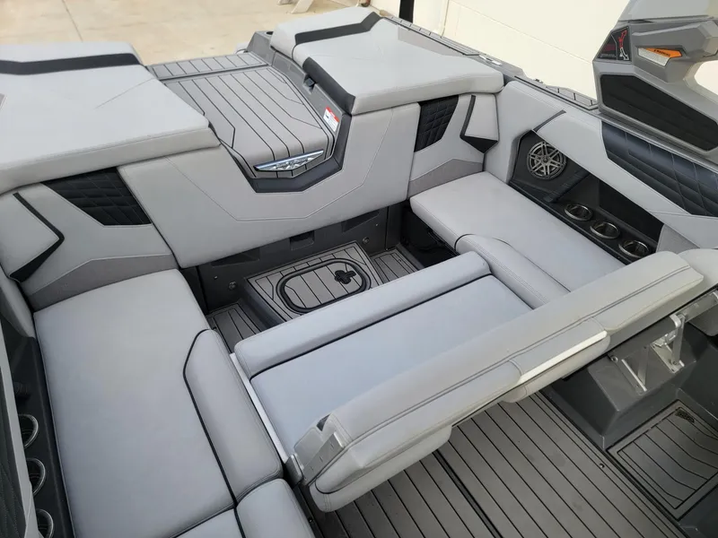 Slide: The Image of 2022 Nautique Super Air Nautique S21 interior with gray seating and modern design. - 12