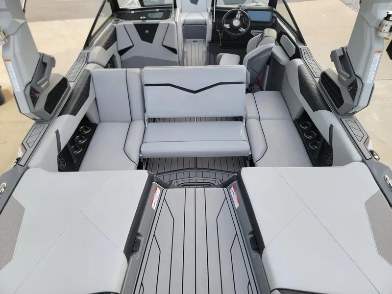 Slide: The Image of 2022 Nautique Super Air Nautique S21 interior with gray seating and modern design. - 13