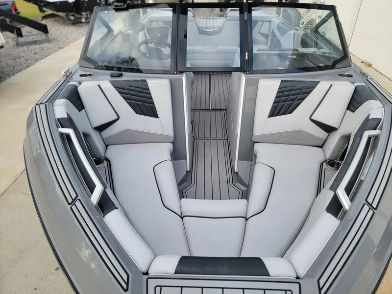Slide: The Image of 2022 Nautique Super Air Nautique S21 interior with sleek gray seating and modern design. - 6