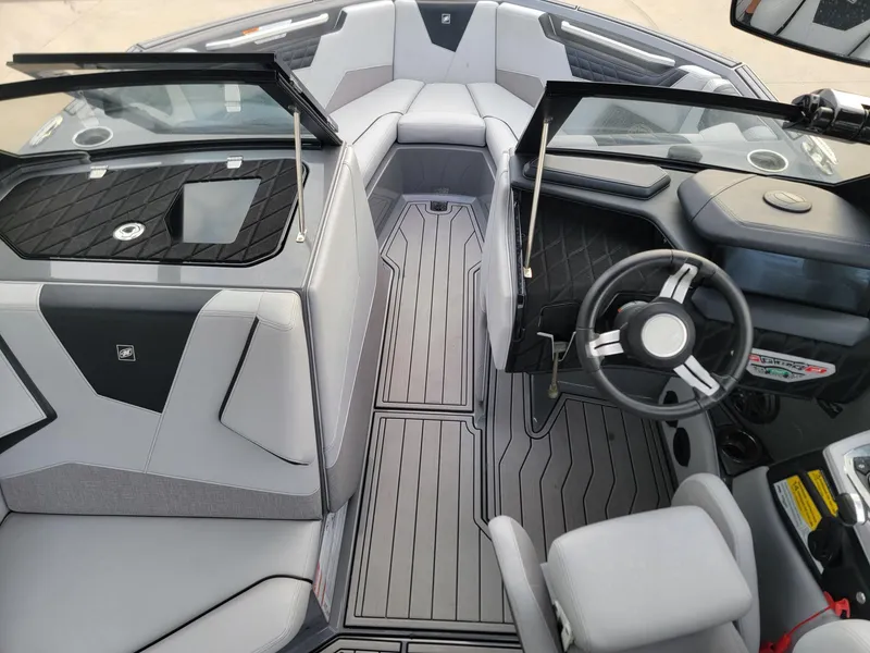 Slide: The Image of 2022 Nautique Super Air Nautique S21 interior with sleek design and modern dashboard. - 7