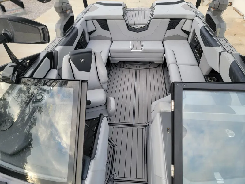 Slide: The Image of 2022 Nautique Super Air Nautique S21 interior with sleek gray seating and modern design. - 8