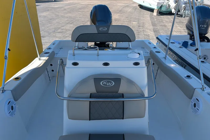 Slide: The Image of 2026 Key West 179 FS boat interior with seating and console, featuring modern design elements. - 13