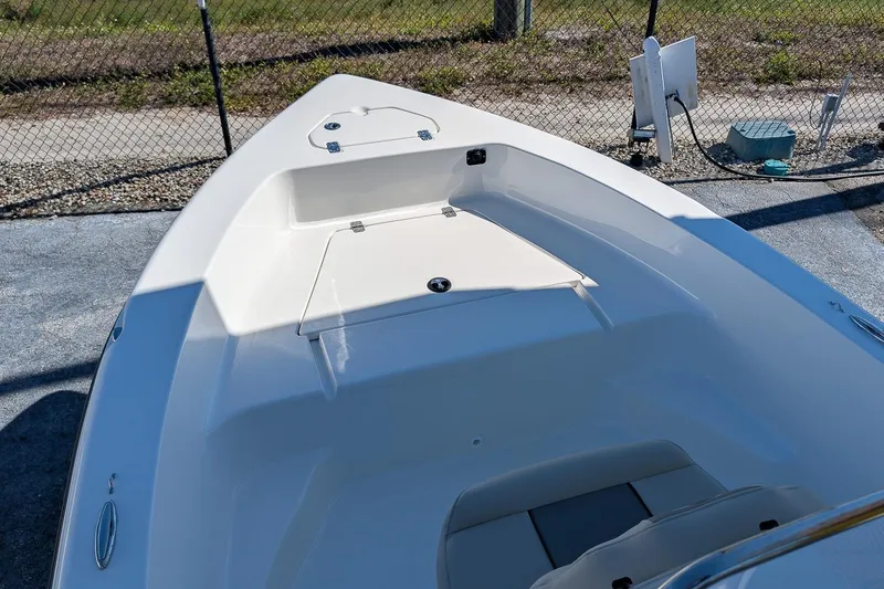 Slide: The Image of 2026 Key West 179 FS boat interior, featuring spacious seating and storage compartments. - 14